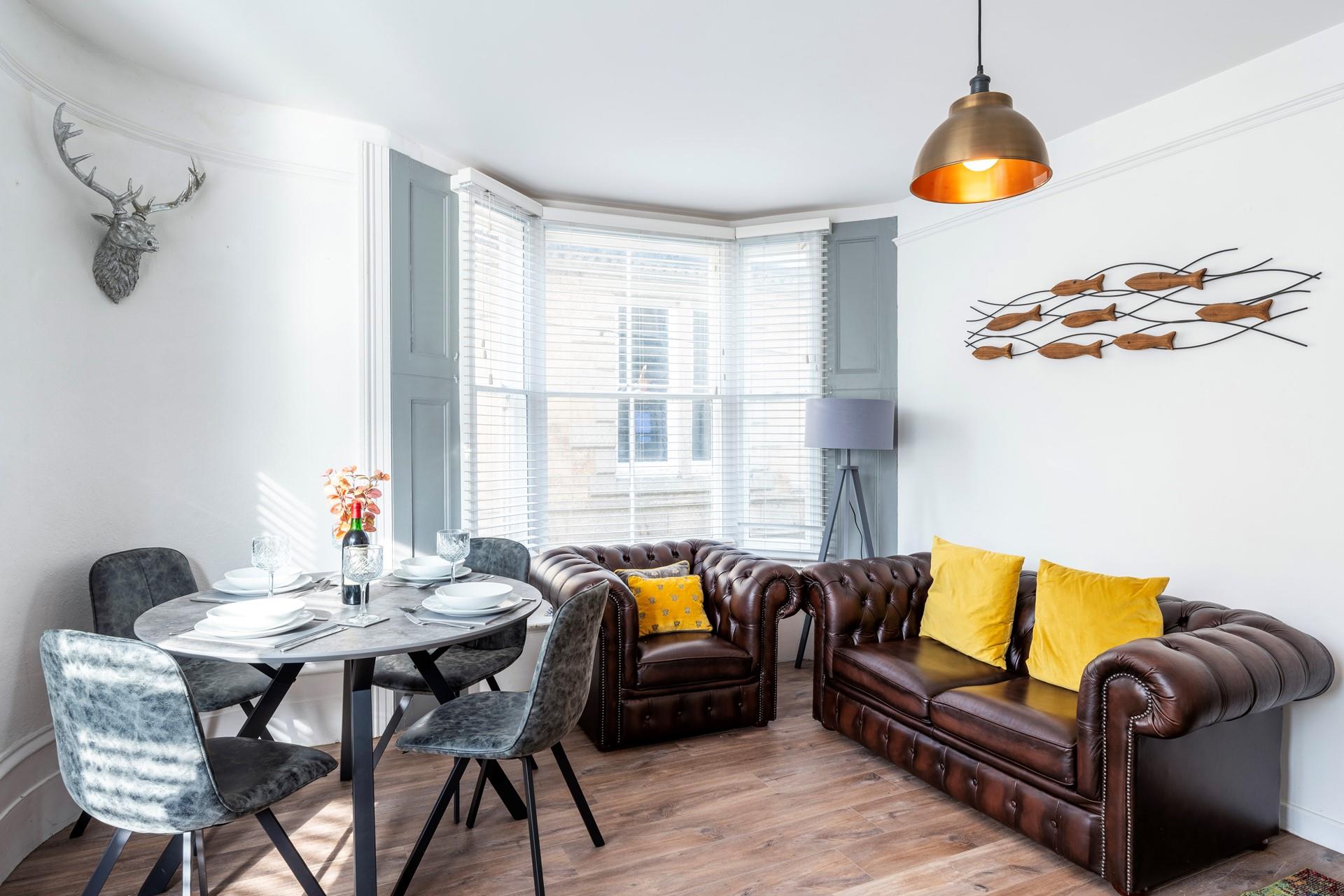 Sink into the armchair and put your feet up in the cheerful sitting room.