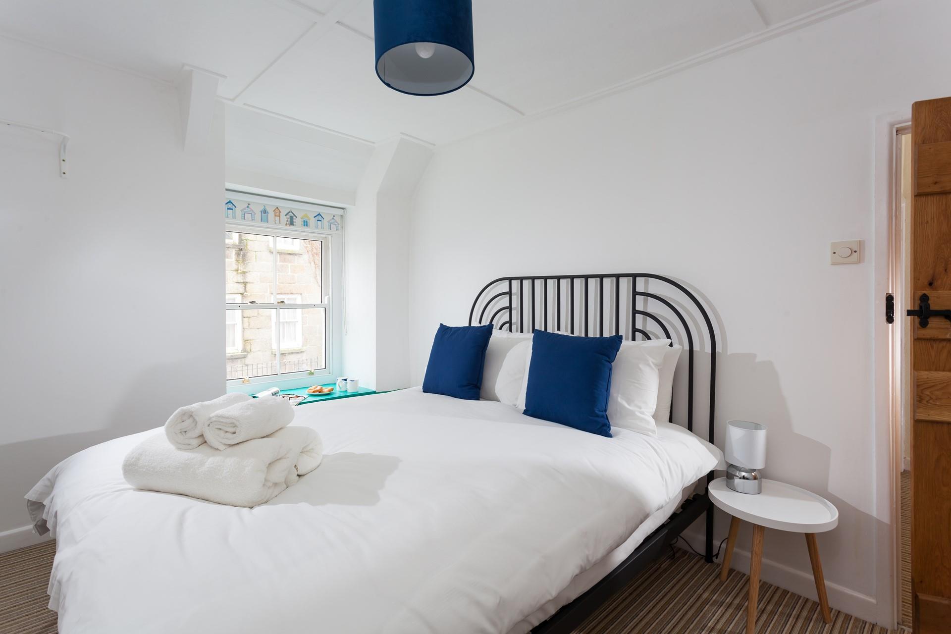 Fluffy towels await you in the cosy bedroom after a morning shower.
