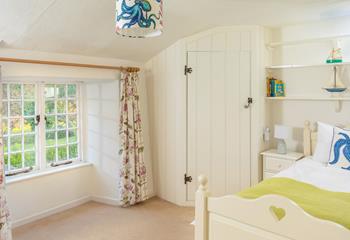 Bedroom 4 has a single bed with a trundle for children and looks out to the beautiful garden.