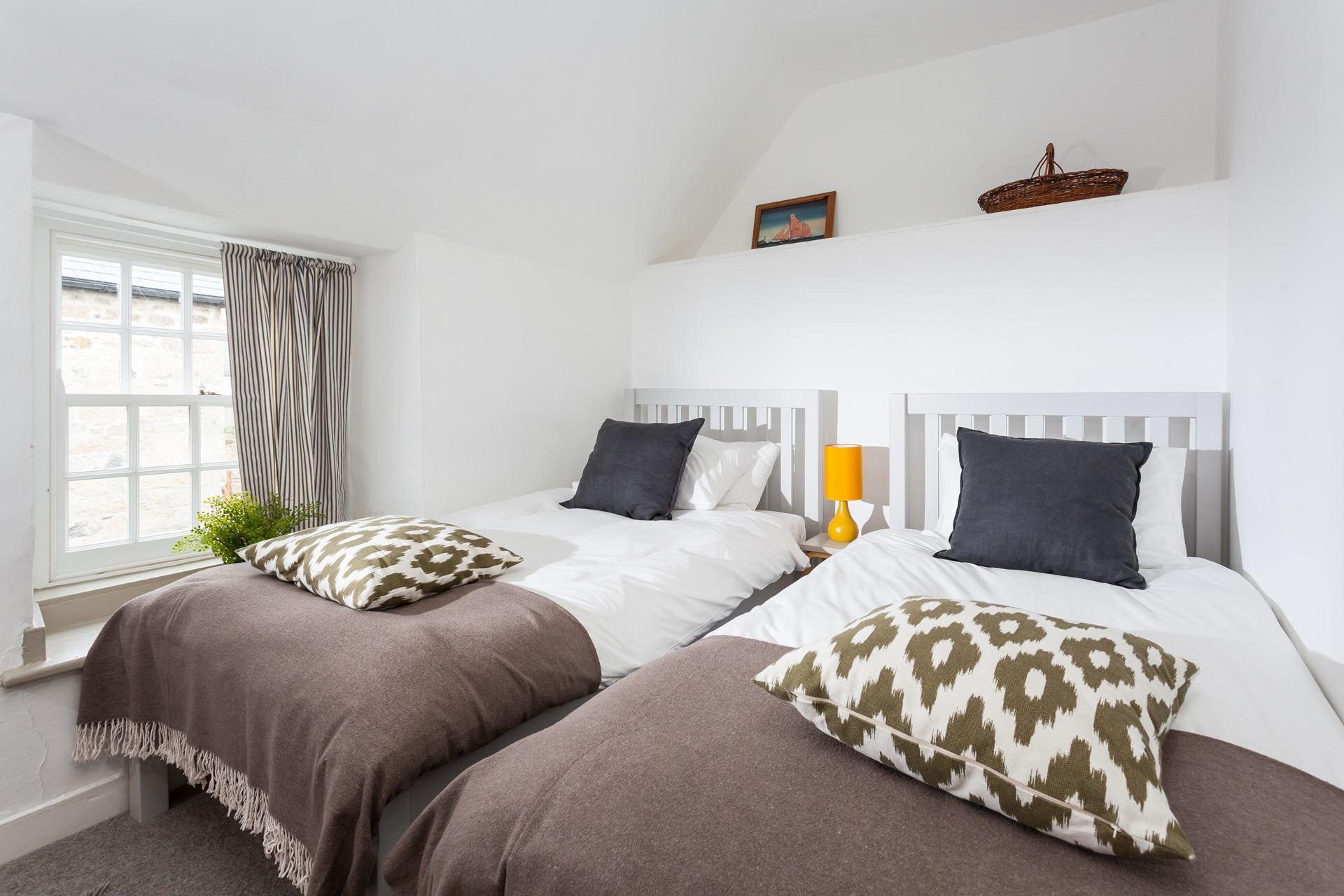 The twin beds are perfect for adults or children to enjoy a restful night's sleep.