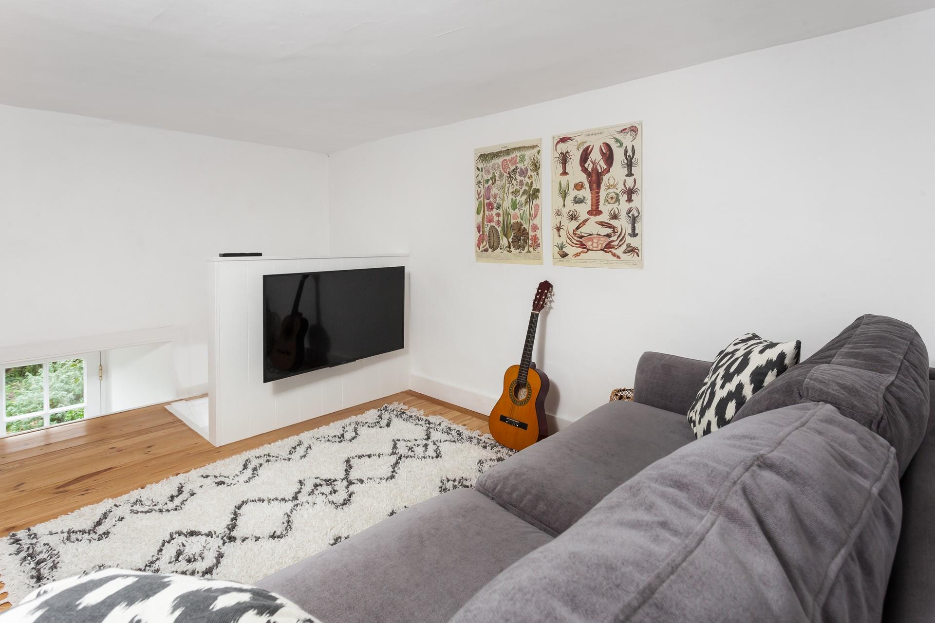 Climb the stairs to the mezzanine which features a double sofa bed and TV.