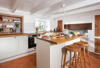 The cottage-style kitchen is a dream to cook a family feast in.