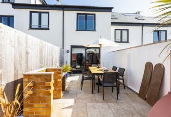 The paved garden is perfect for al fresco summer suppers with friends. 