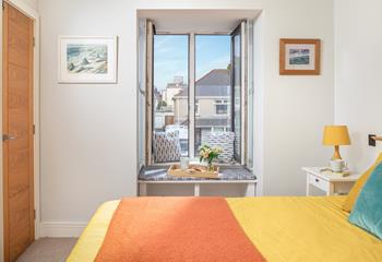 Perch on the window seat with your morning coffee and catch a glimpse of the sea. 