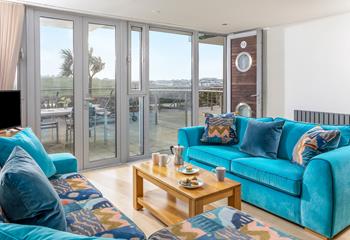 The sitting room has a bright blue theme and is the perfect space to relax and unwind in the evening.