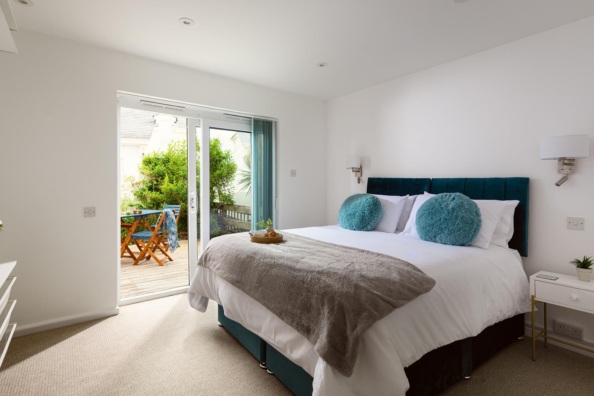 Climb into the spacious king size bed and relax on the soft sheets after a long day.