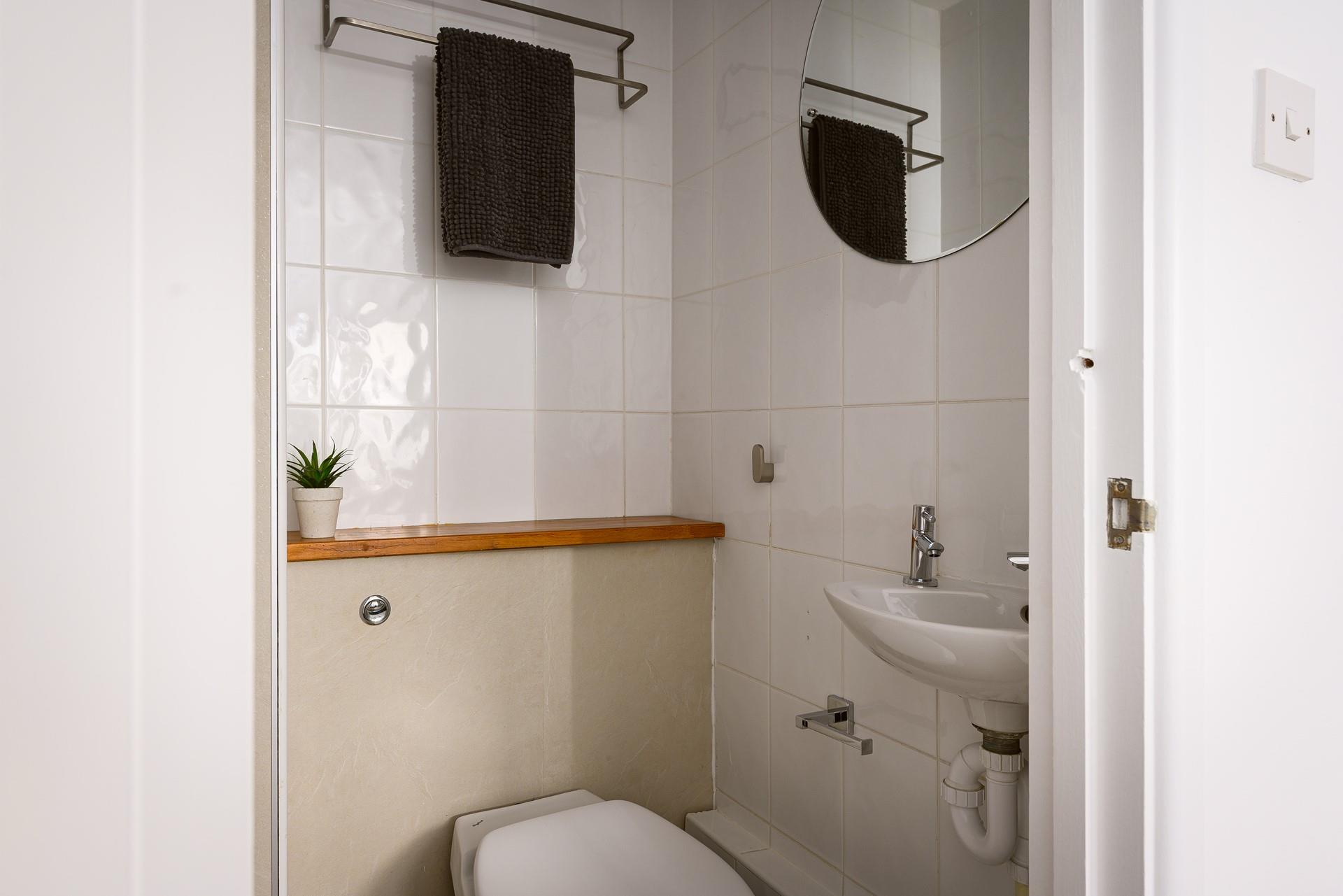 Bedroom 1 has an en suite with WC and basin.