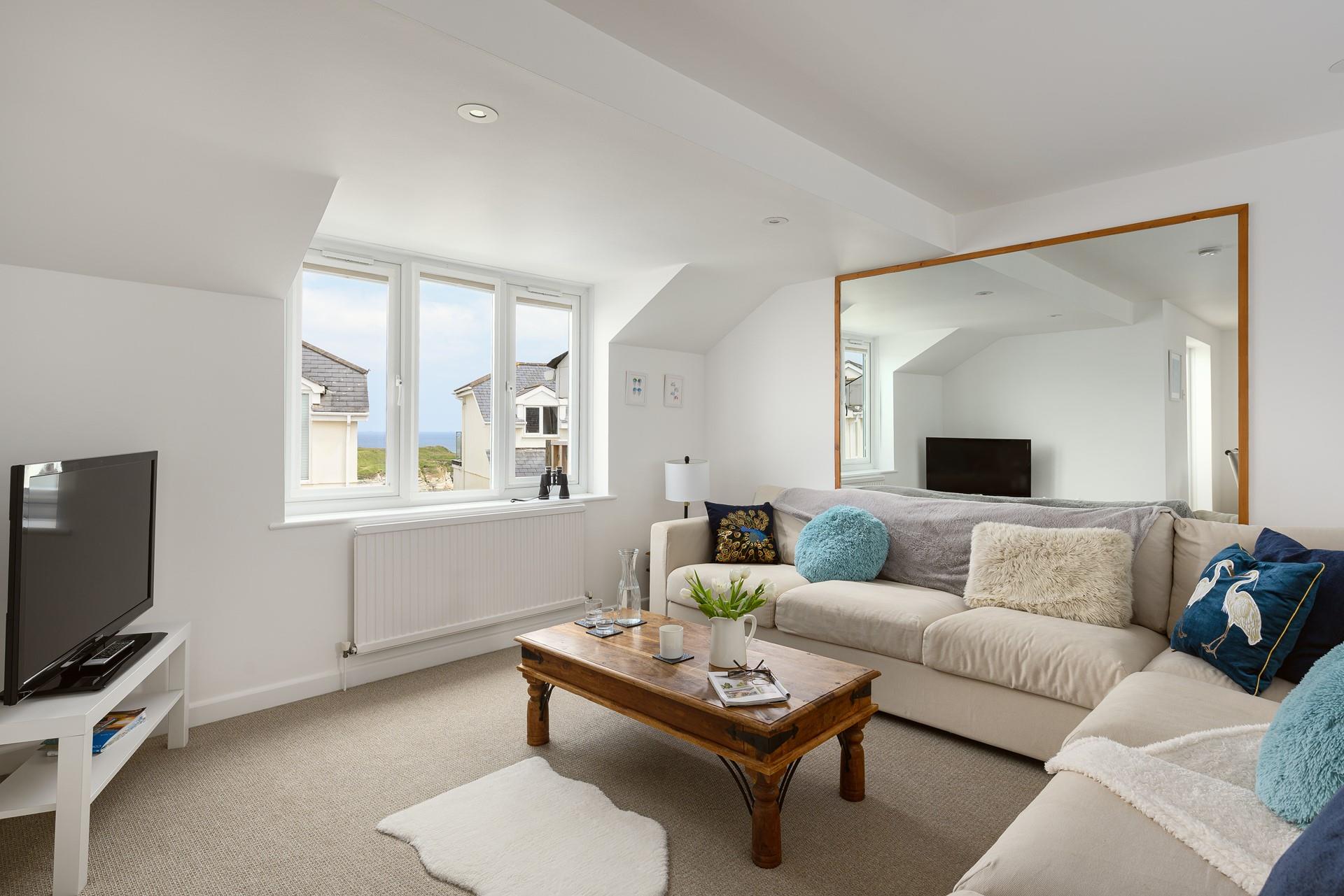 Sink into the comfortable sofa after a day of sunbathing on Lusty Glaze beach.