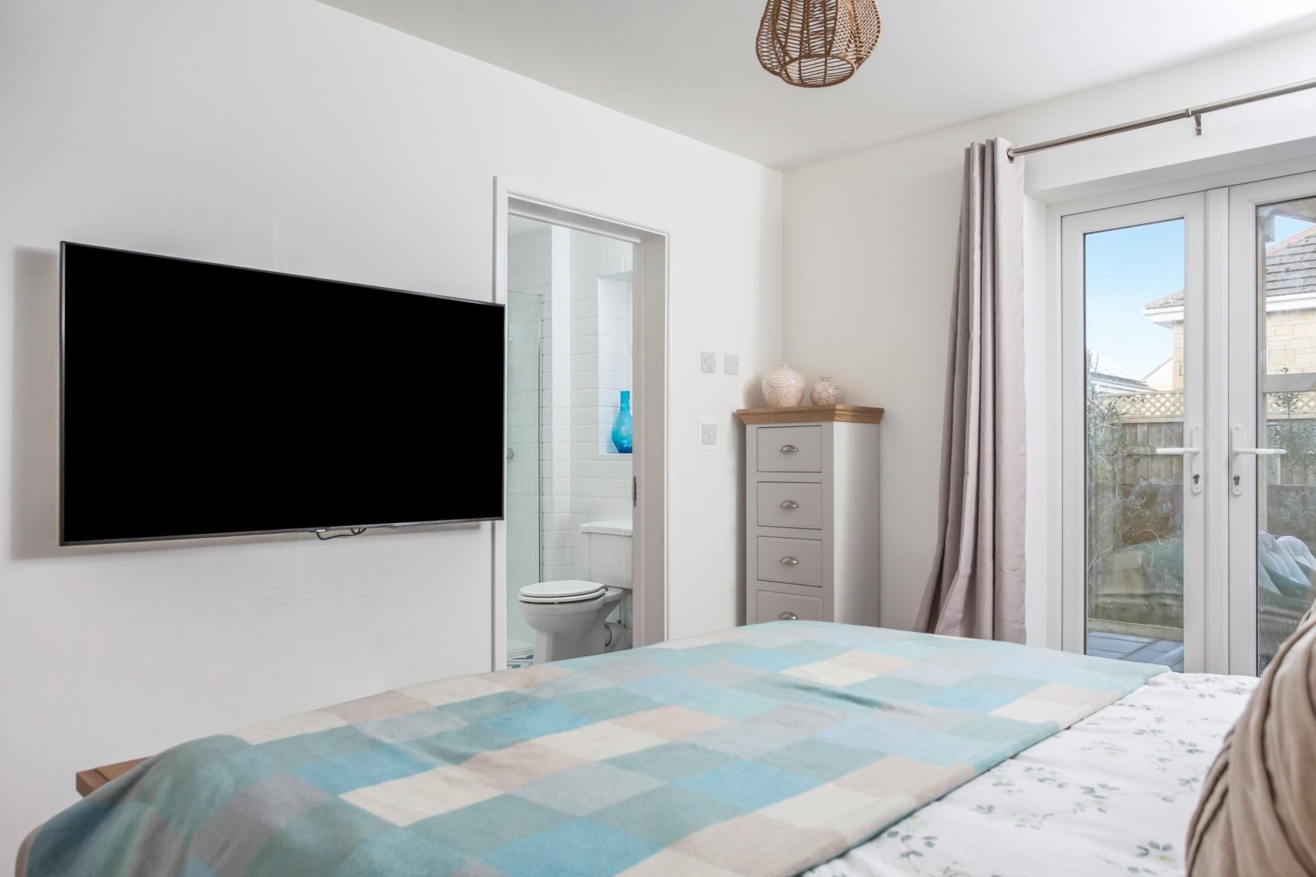 Climb out of bed and into the en suite to get ready for the day.