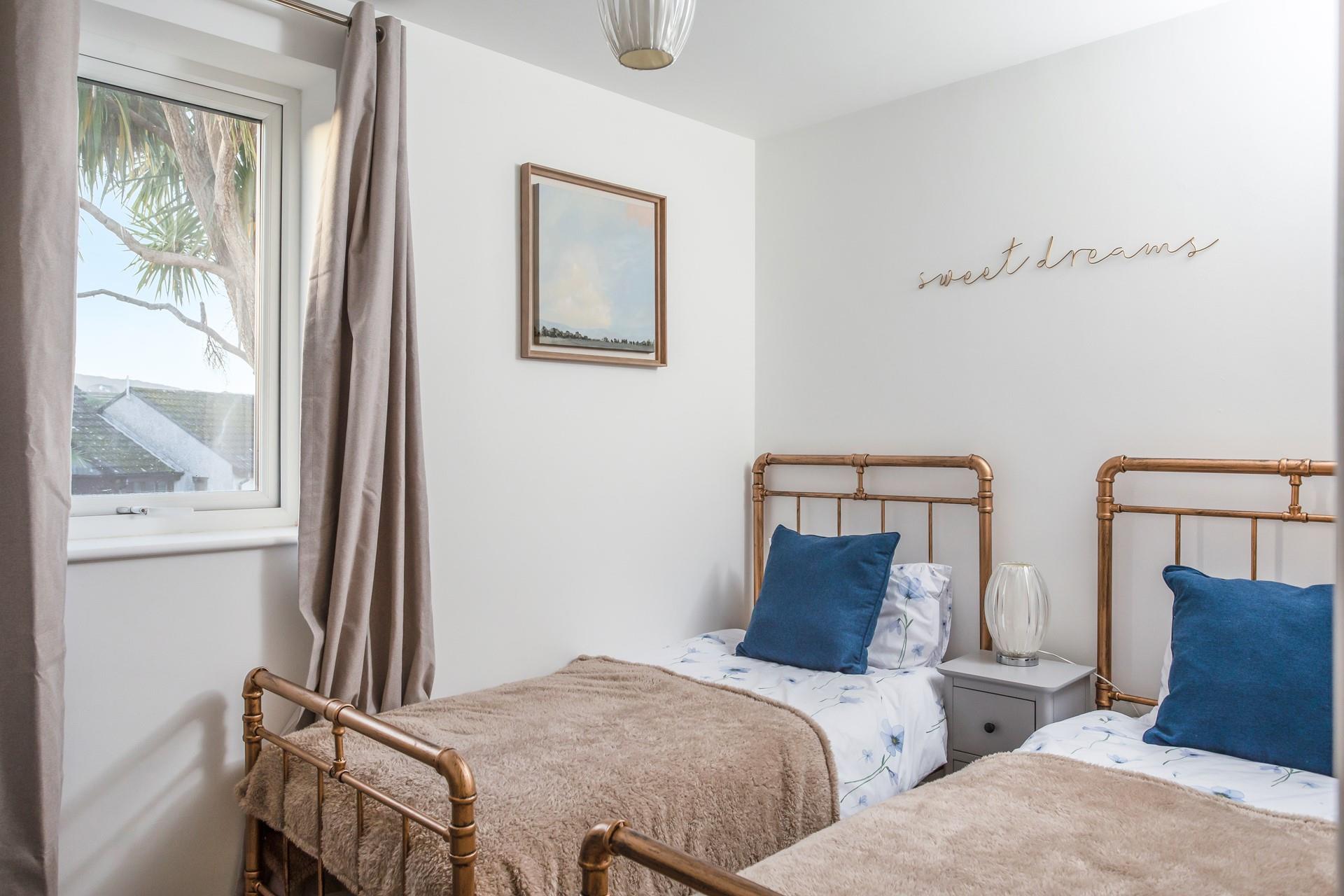 We love the quirky twin beds in bedroom 2 and the sweet dreams sign!