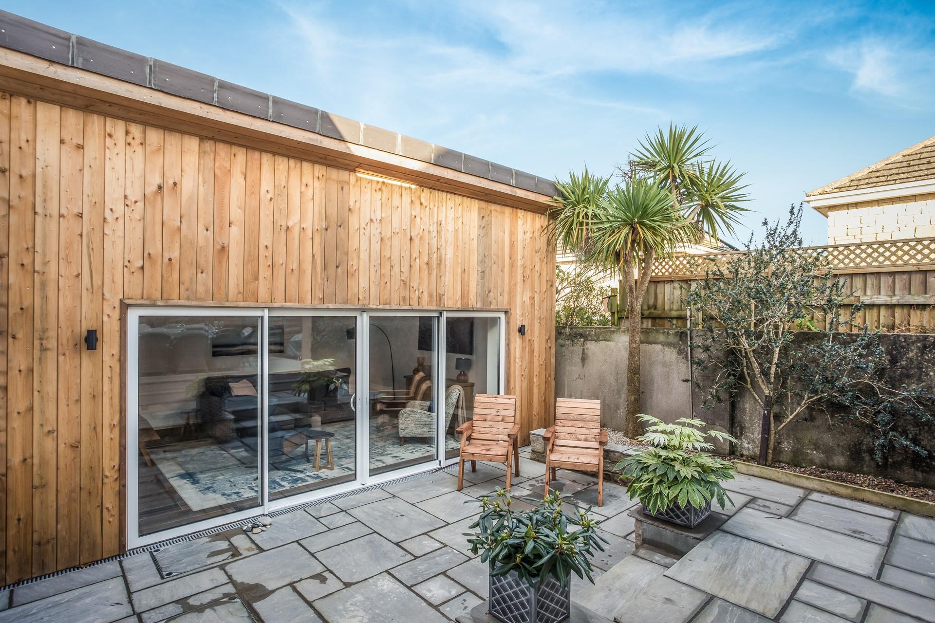 Sunbathe the afternoon away in the garden with a glass of something cold.