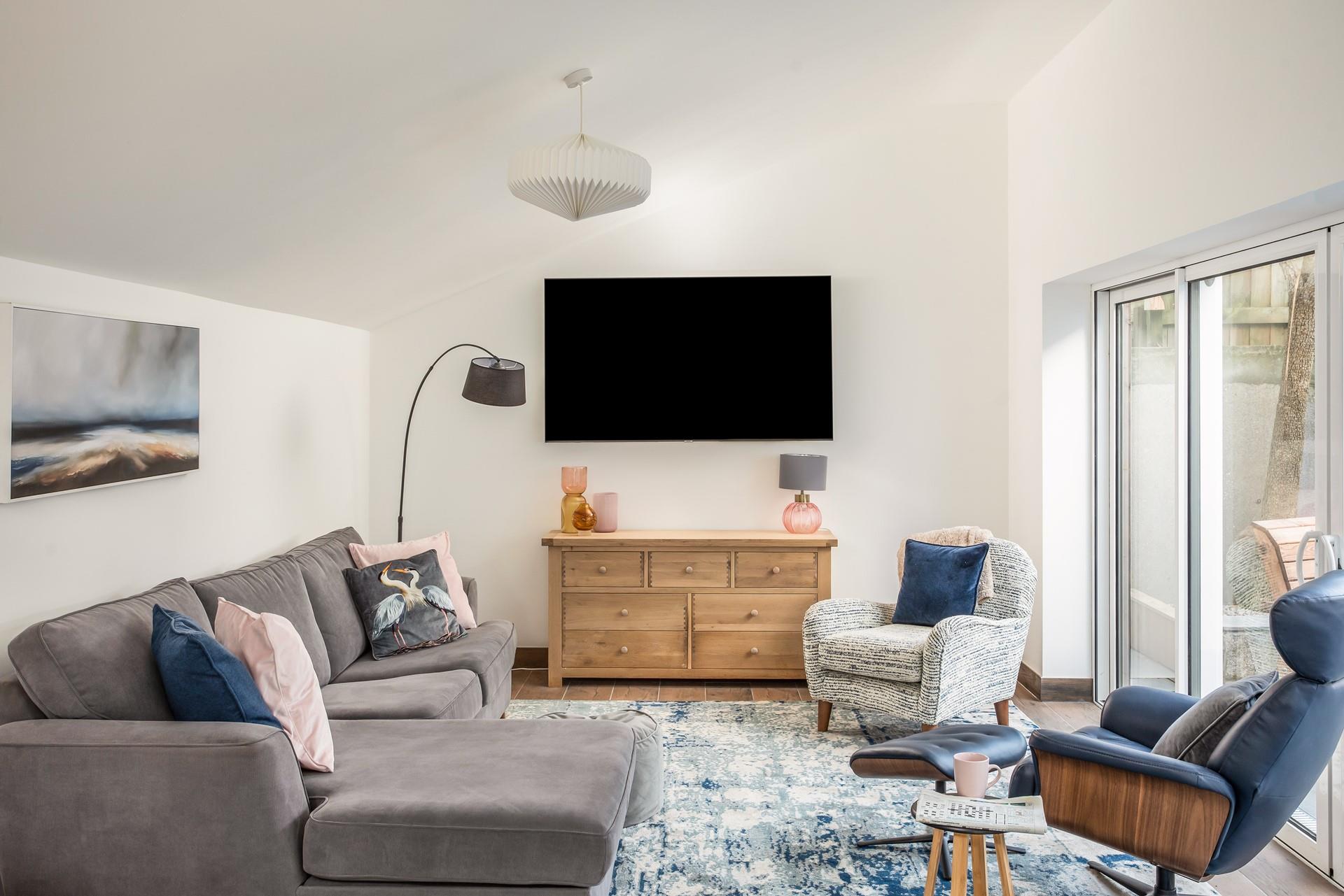 Sink into the sumptuous sofa and pick a movie to watch after a day of exploring.