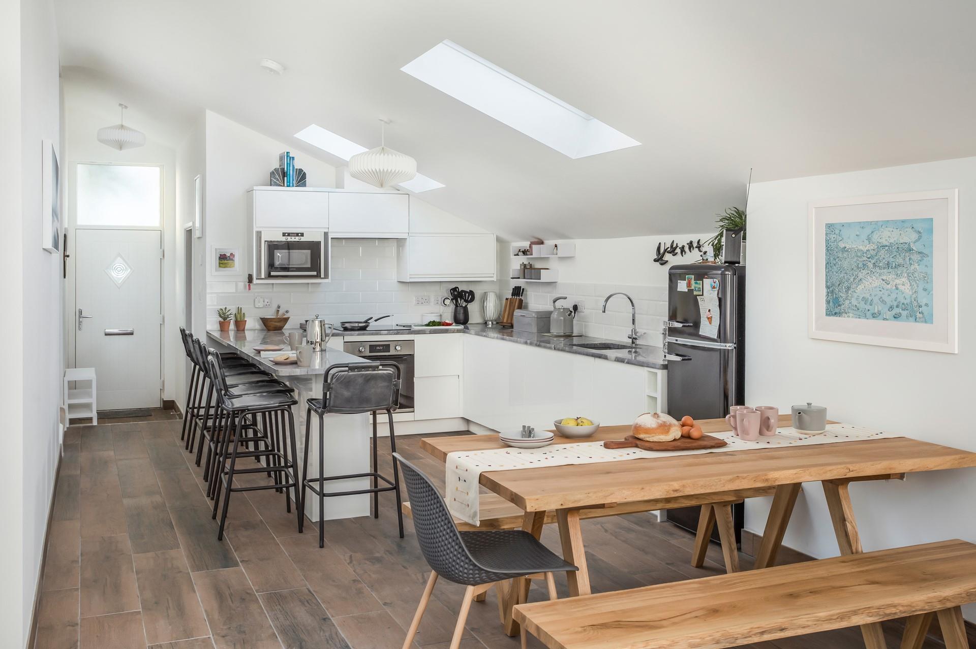 The kitchen is modern and sleek, perfect for cooking up a storm.