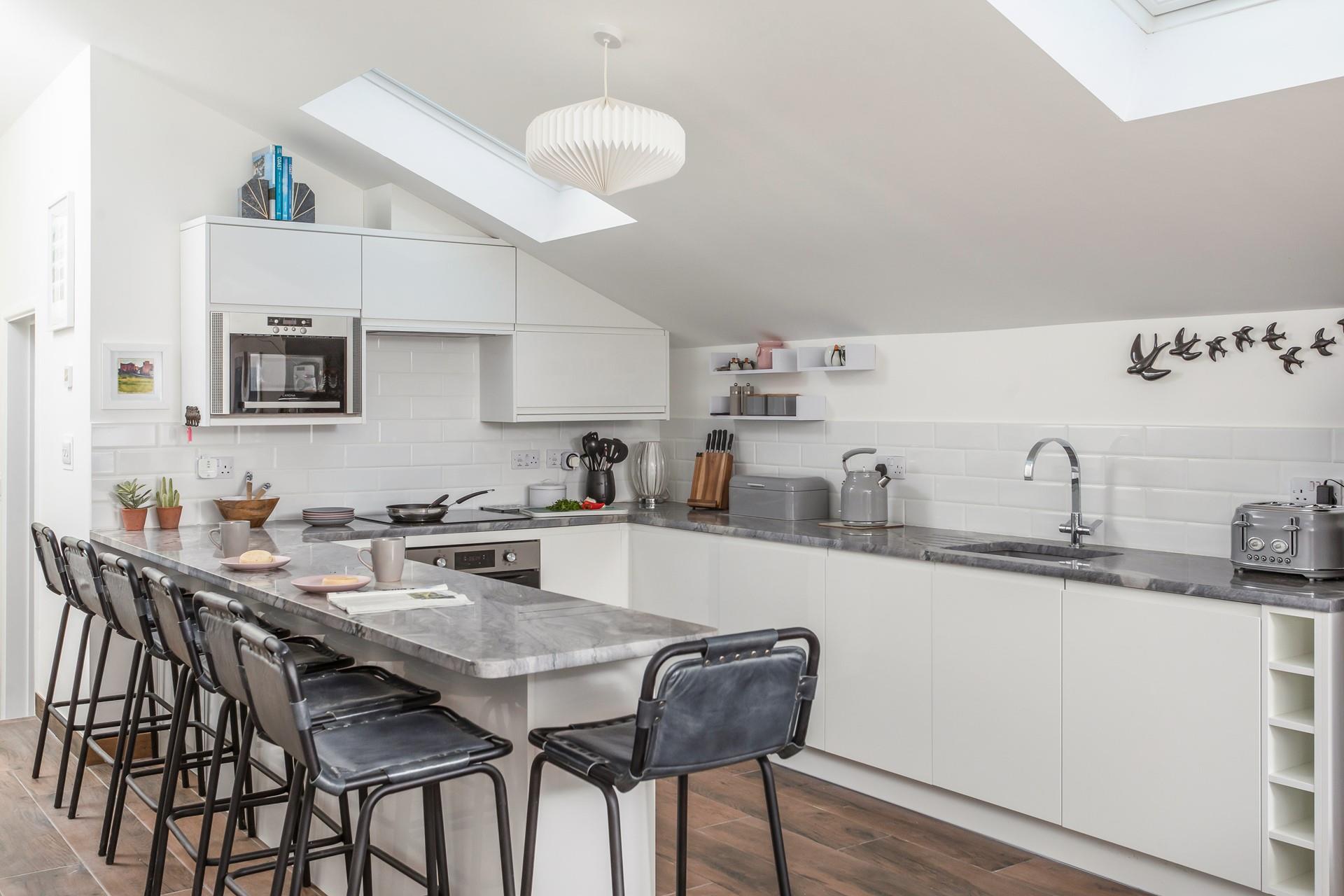 Sit at the breakfast bar and tuck into fresh pastries in the morning.