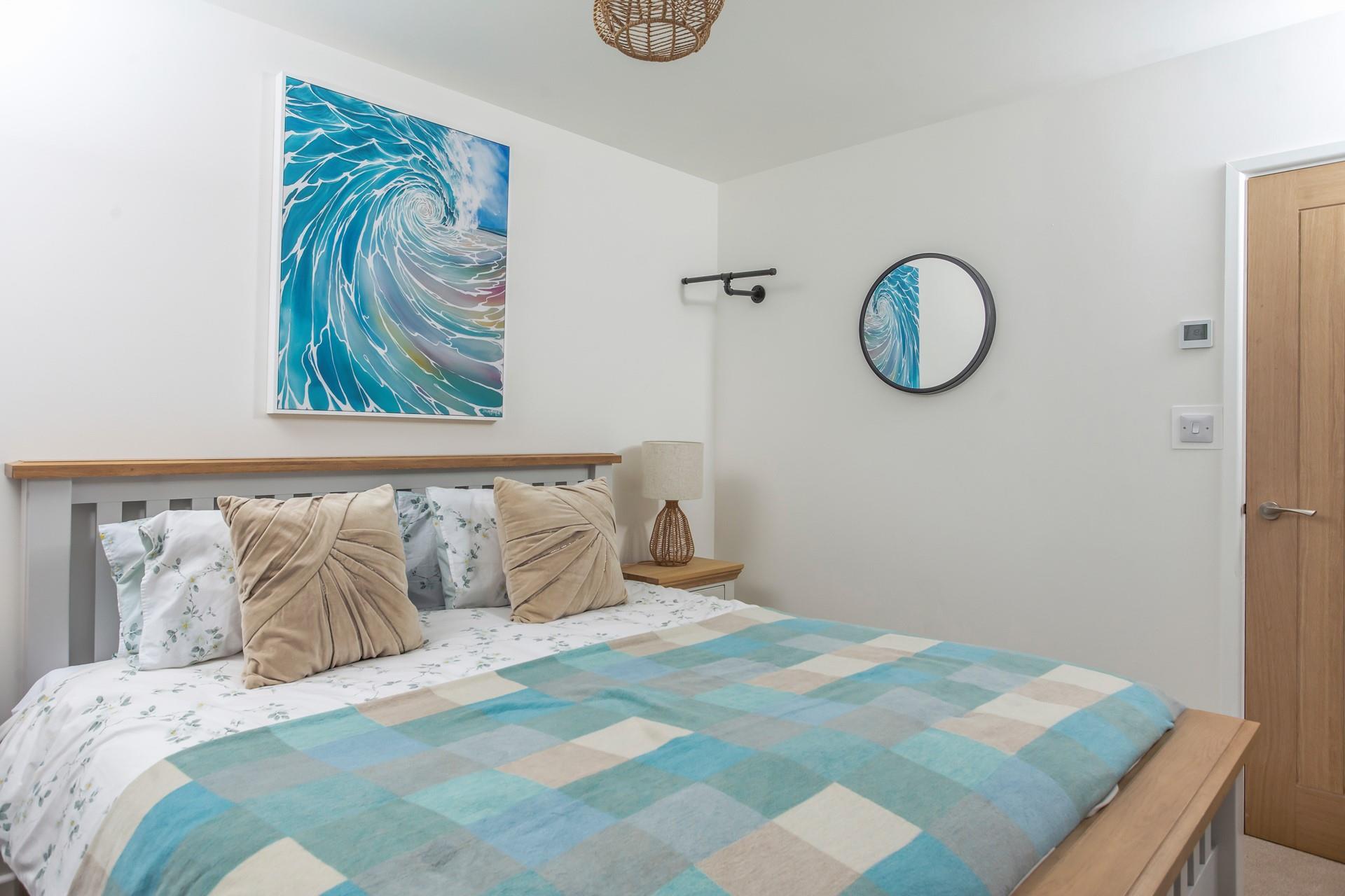 Shades of blue and green reflect the close proximity to the sea.