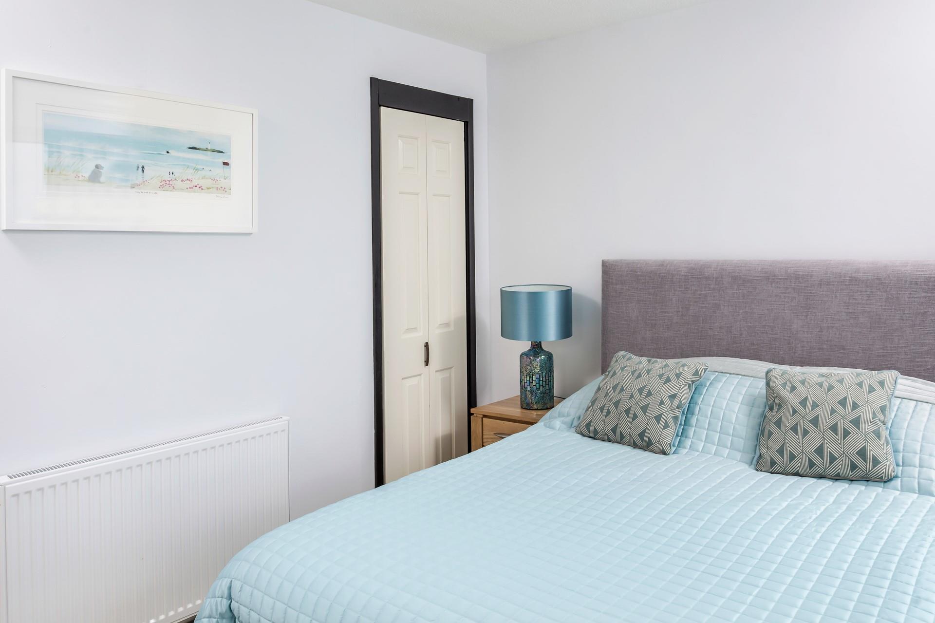 The calming blue decor reflects the apartment's close proximity to the sea.