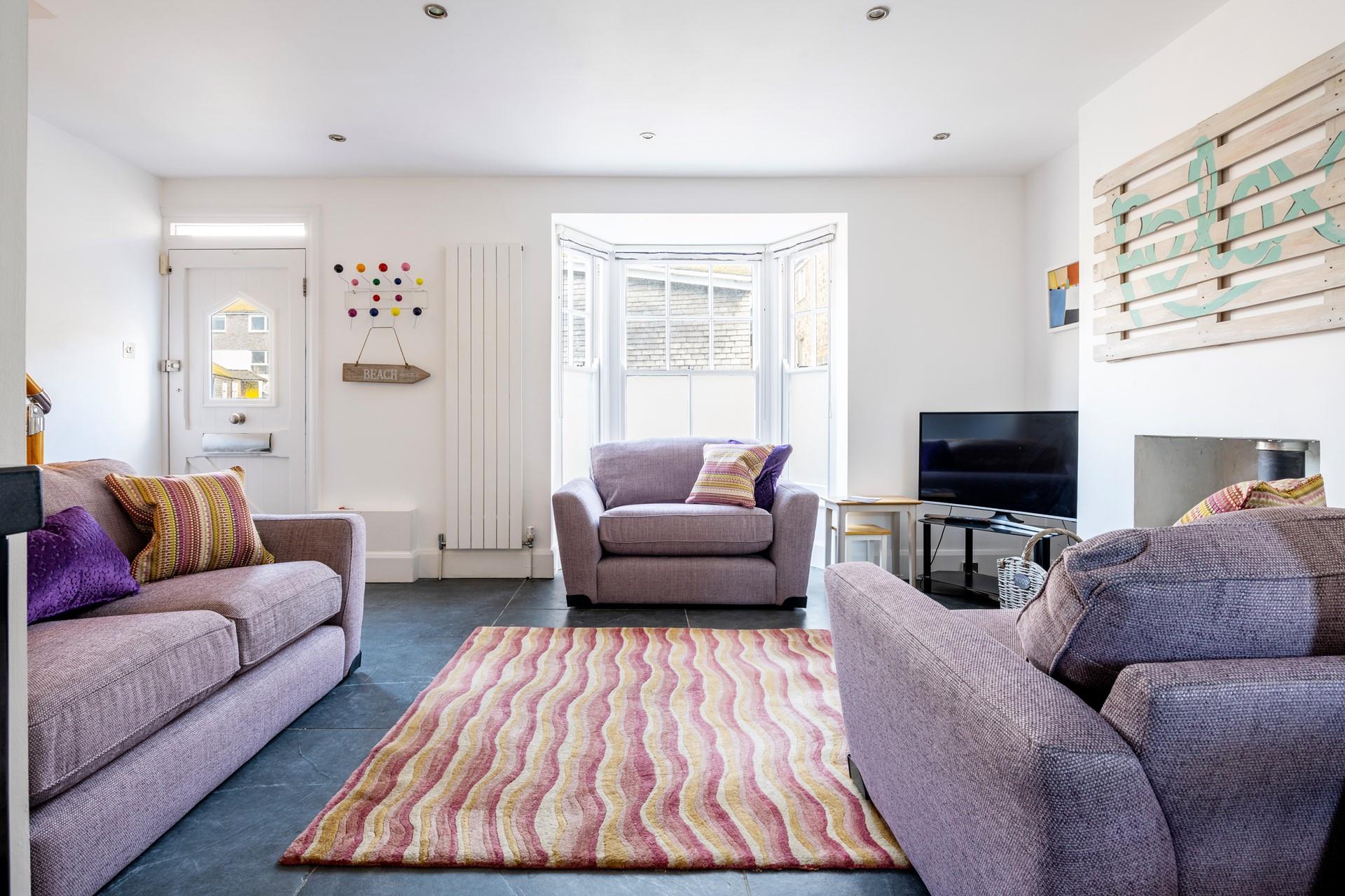 Snuggle up and watch your favourite film together with the woodburner lit.