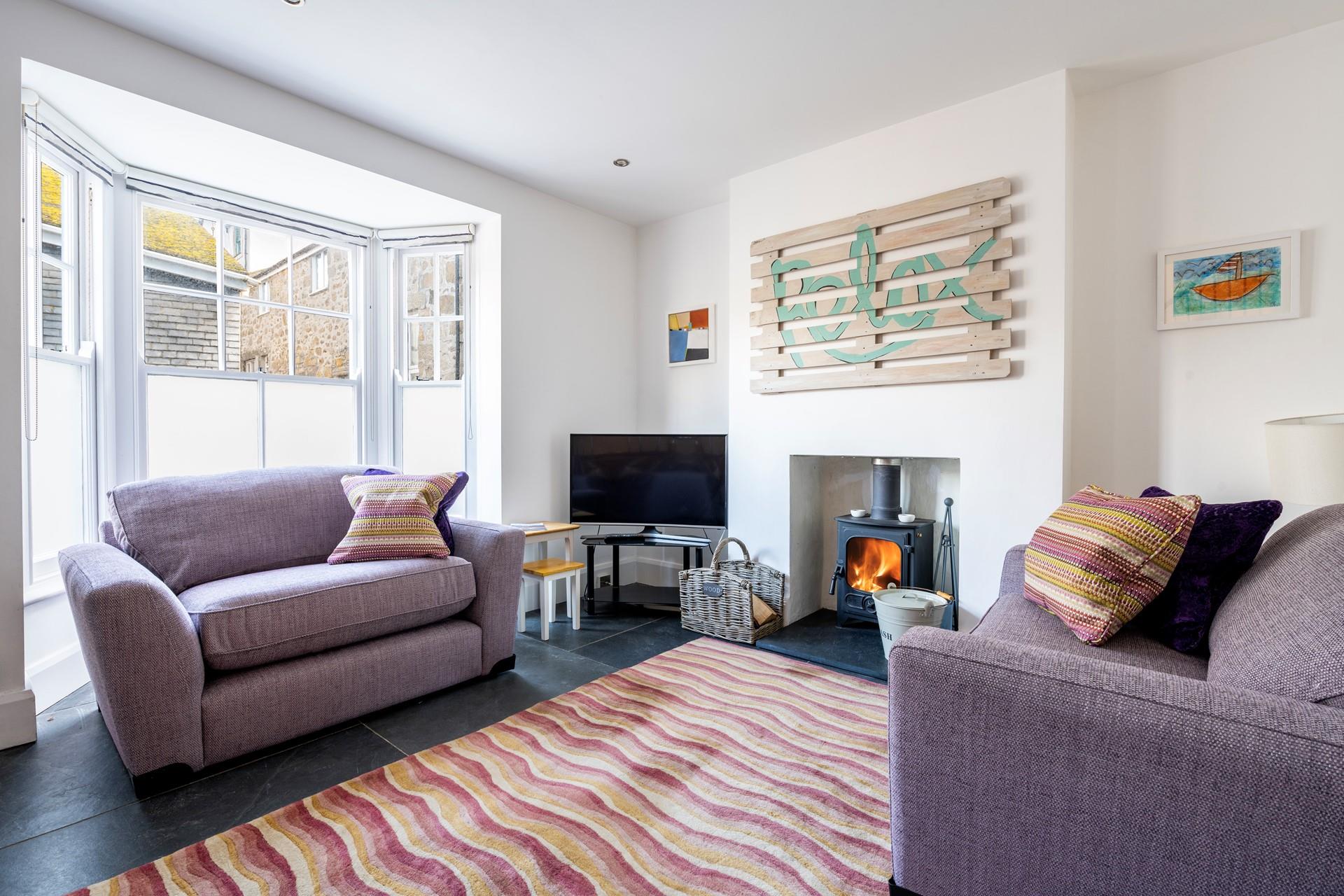 The sitting room is a bright and colourful space to chill out in the evenings.