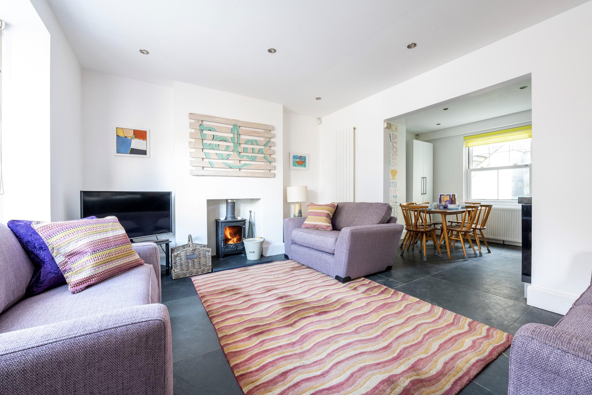 Sink into the sumptuous sofa with the woodburner crackling in the background and relax...