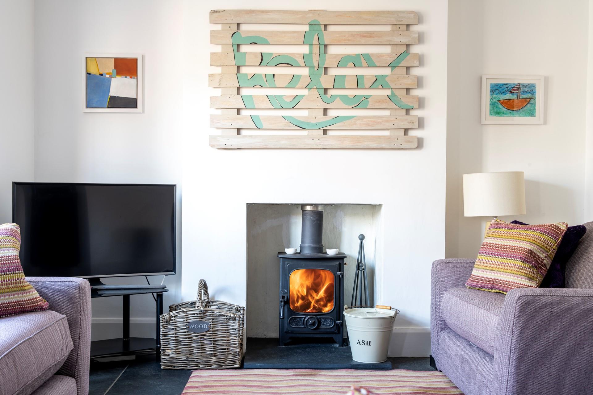 Listen to the woodburner crackle for the ultimate cosy evening, and as the sign says, relax!