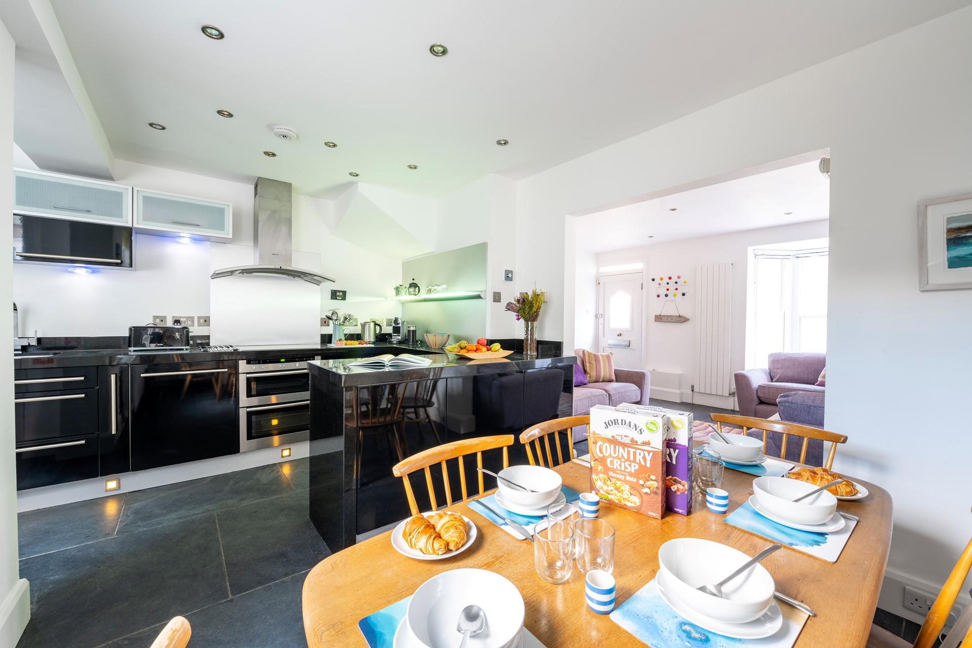 The kitchen is modern and sleek for cooking tasty meals and preparing hearty breakfasts.