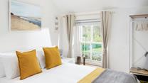 Sink into the soft sheets of the king size bed and drift off for a dreamy night's sleep.