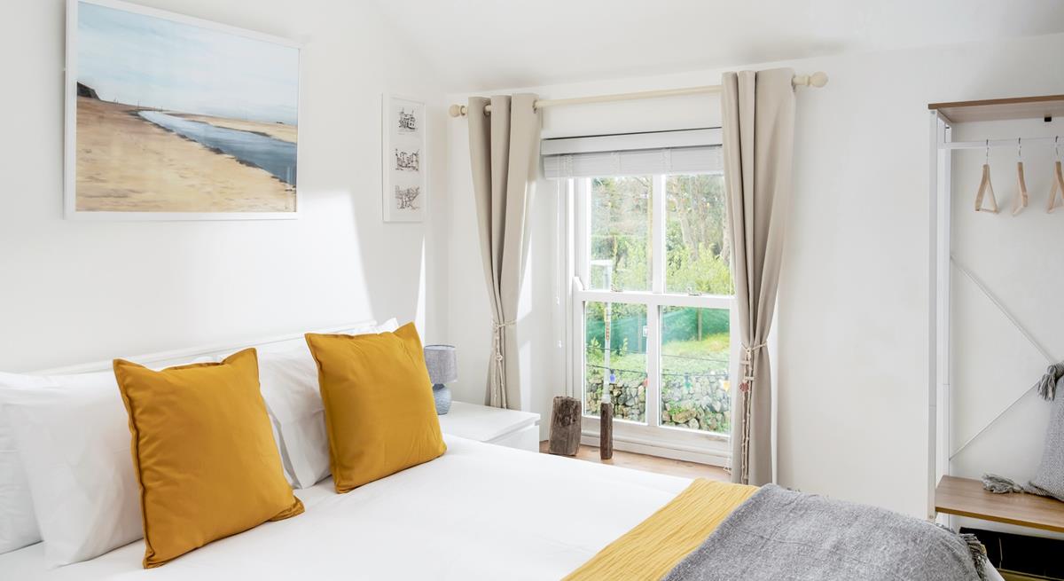 Sink into the soft sheets of the king size bed and drift off for a dreamy night's sleep.