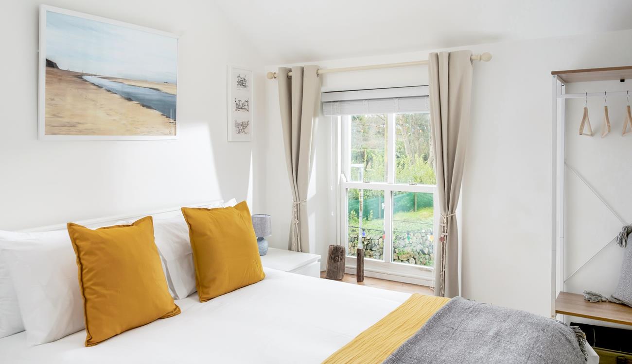 Sink into the soft sheets of the king size bed and drift off for a dreamy night's sleep.