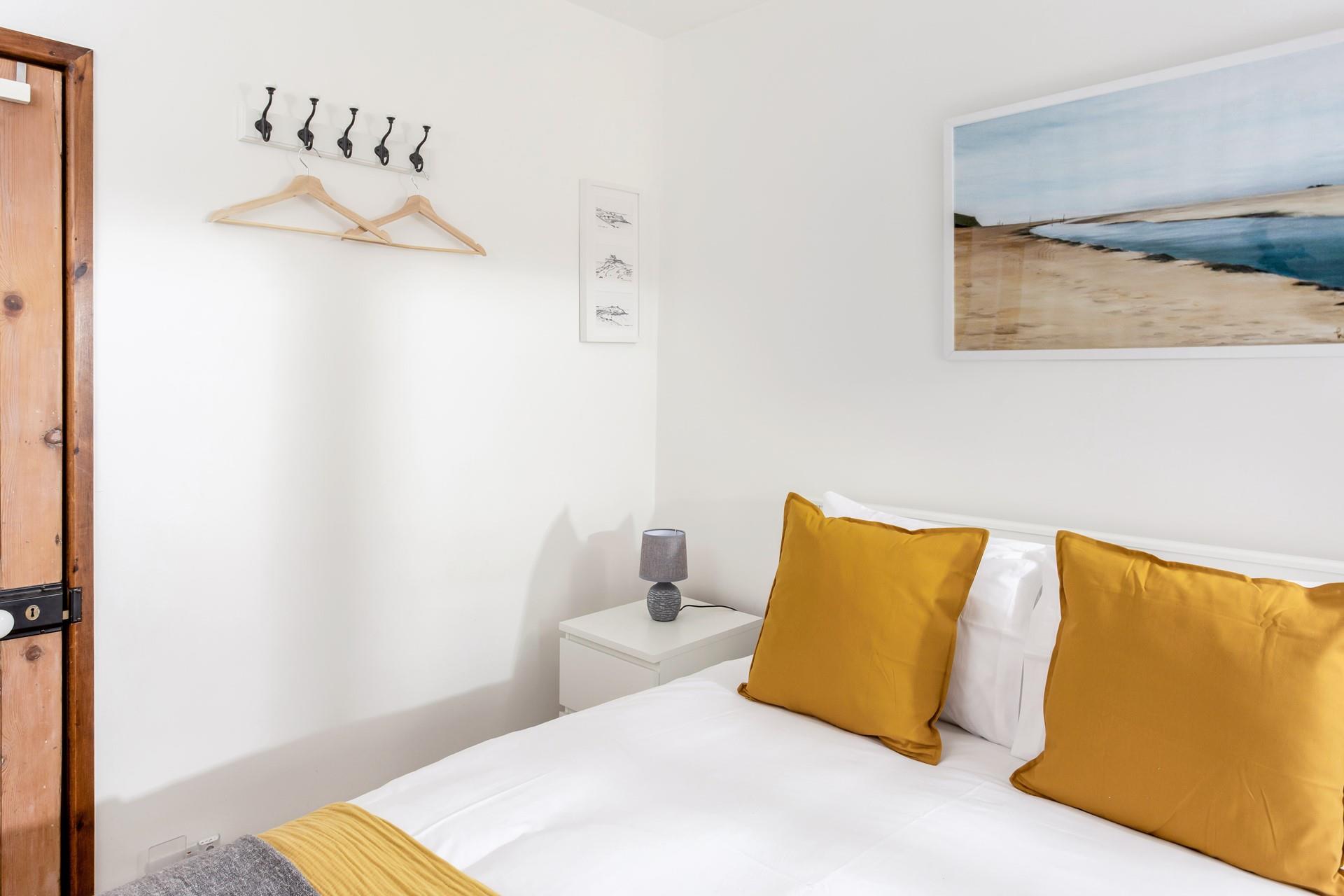 The yellow decor perfectly reflects that the cottage is just one mile from the beach!