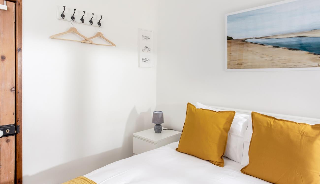 The yellow decor perfectly reflects that the cottage is just one mile from the beach!