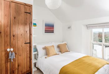 Bedroom 3 has a double bed and ample storage space.