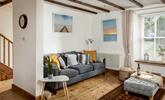 Relax on the sumptuous sofa with a chilled glass of wine after a day exploring Porthleven nearby. - Thumbnail Image
