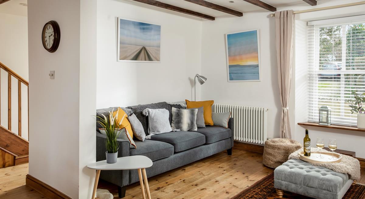 Relax on the sumptuous sofa with a chilled glass of wine after a day exploring Porthleven nearby.