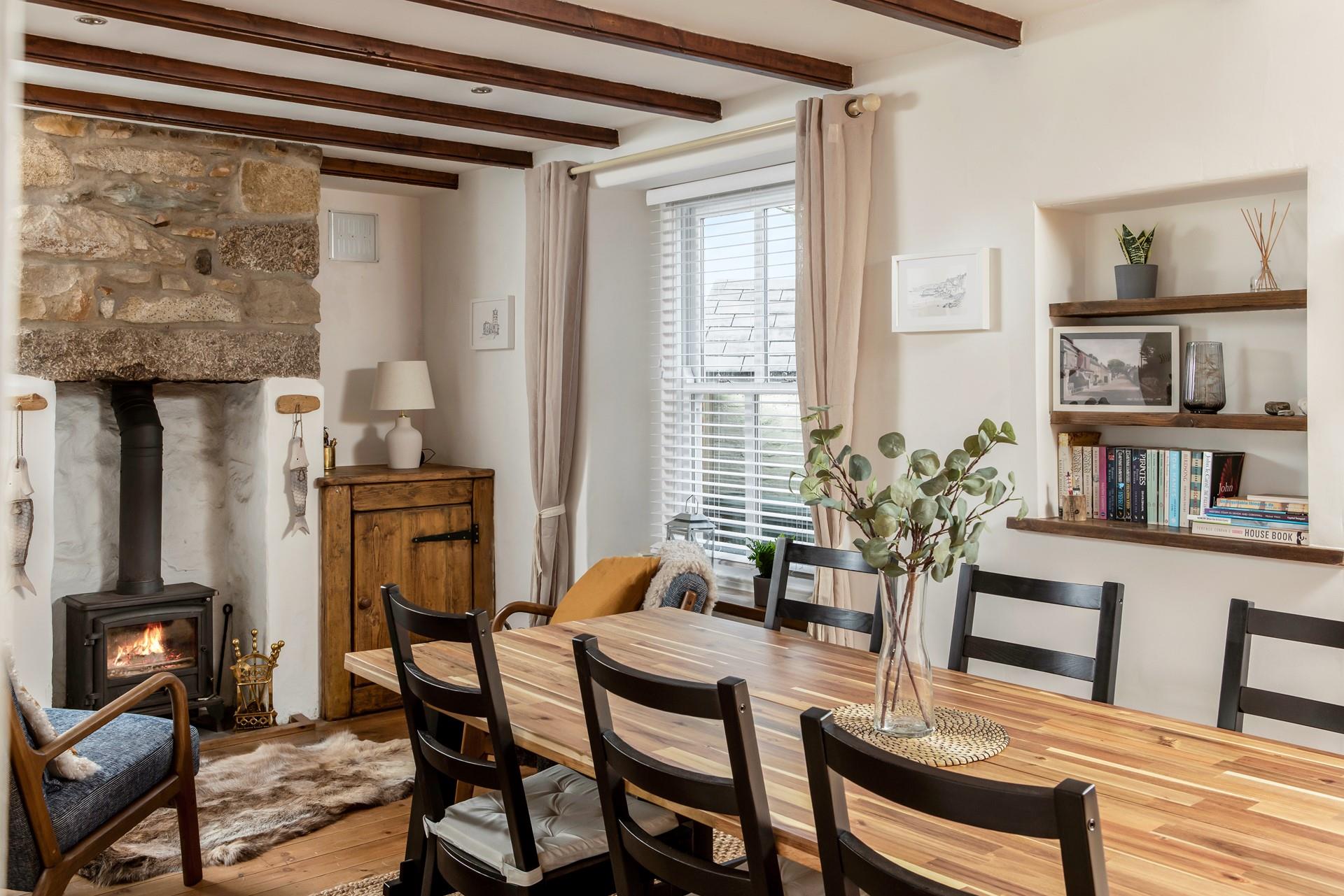 The cottage is filled with traditional Cornish character with its exposed beams and granite fireplace.