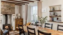 The cottage is filled with traditional Cornish character with its exposed beams and granite fireplace.