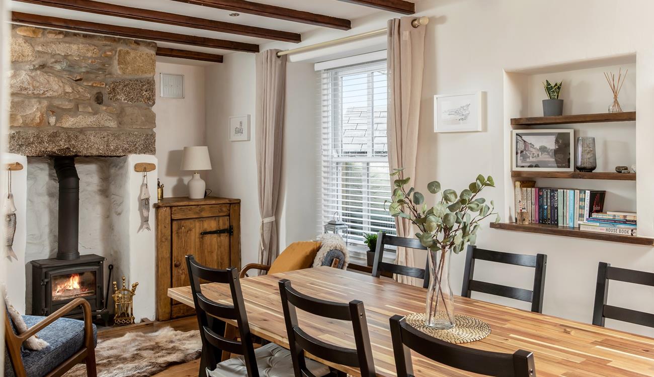 The cottage is filled with traditional Cornish character with its exposed beams and granite fireplace.