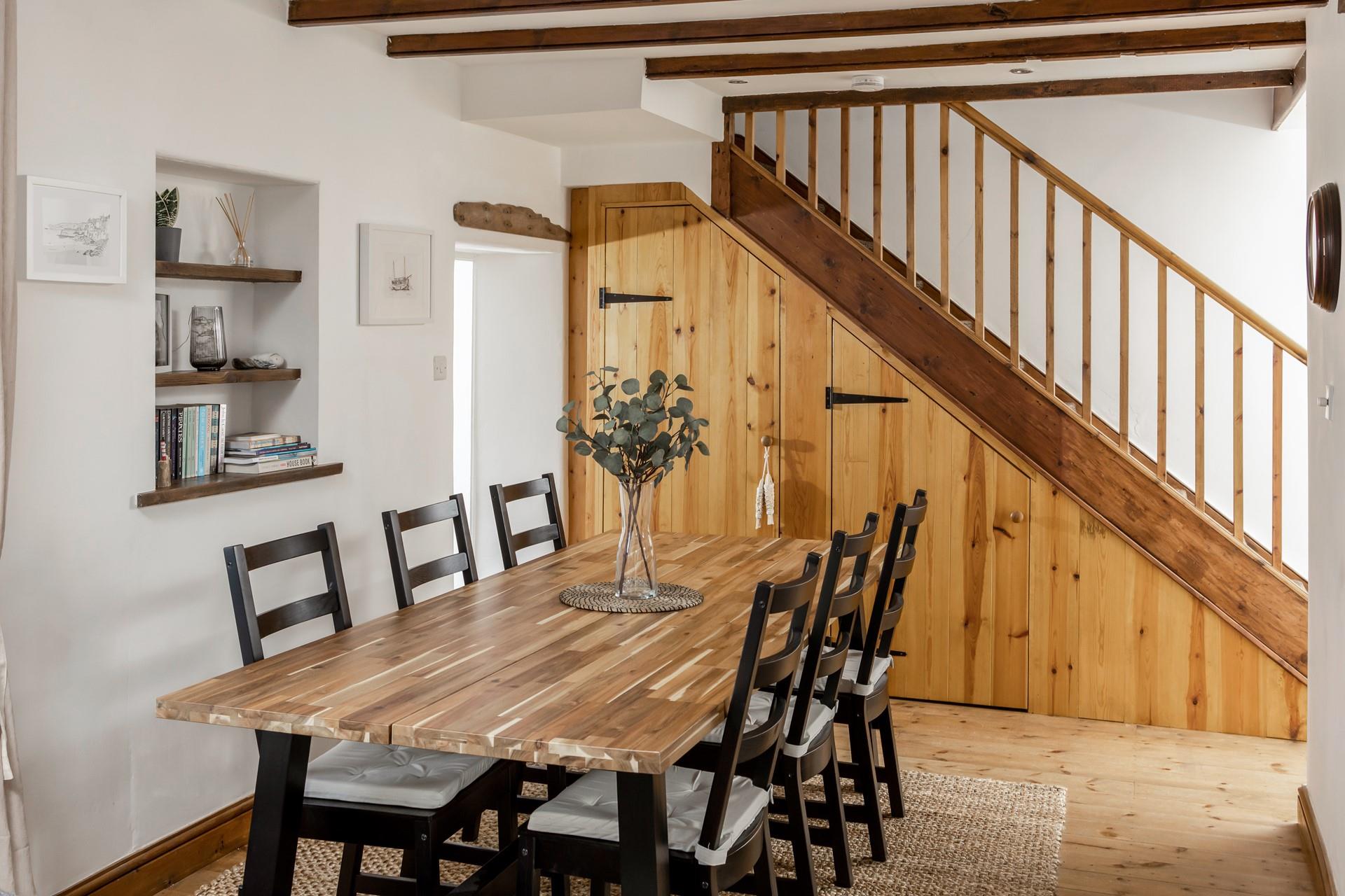 Sit around the dining table ready to devour a tasty meal.