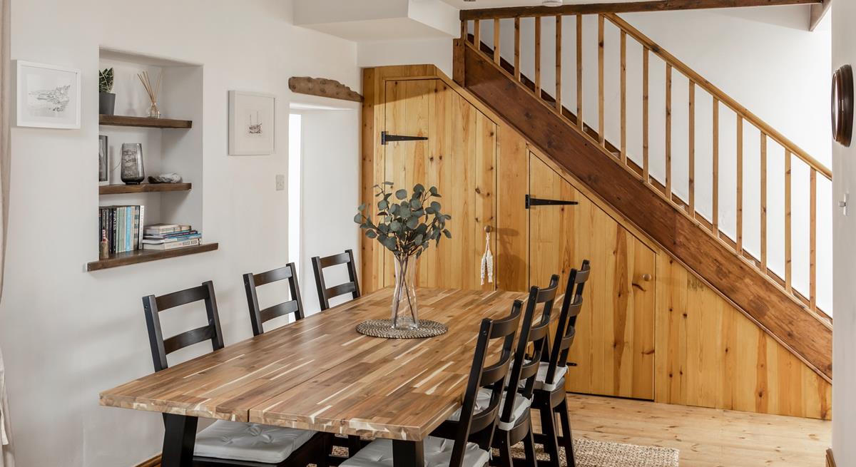 Sit around the dining table ready to devour a tasty meal.