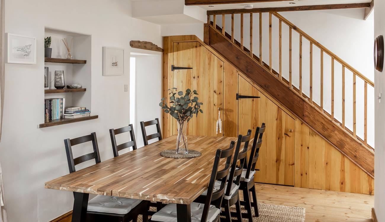 Sit around the dining table ready to devour a tasty meal.