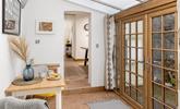 There is additional seating perfect for breakfast in the morning, and open the doors to listen to the morning birdsong. - Thumbnail Image