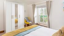 Draw the curtains and snuggle up in bed ready to drift off after a memorable day at the beach.