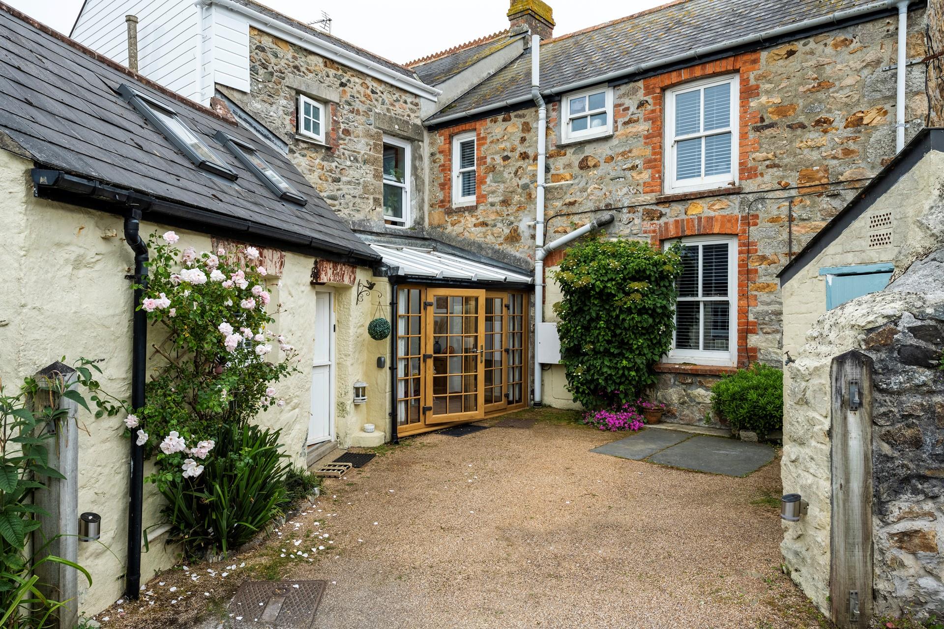 There is parking at the rear of Trewinel Cottage.