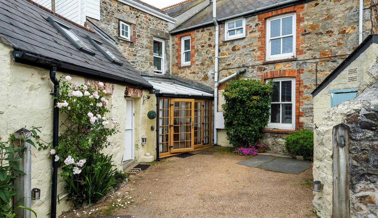 There is parking at the rear of Trewinel Cottage.