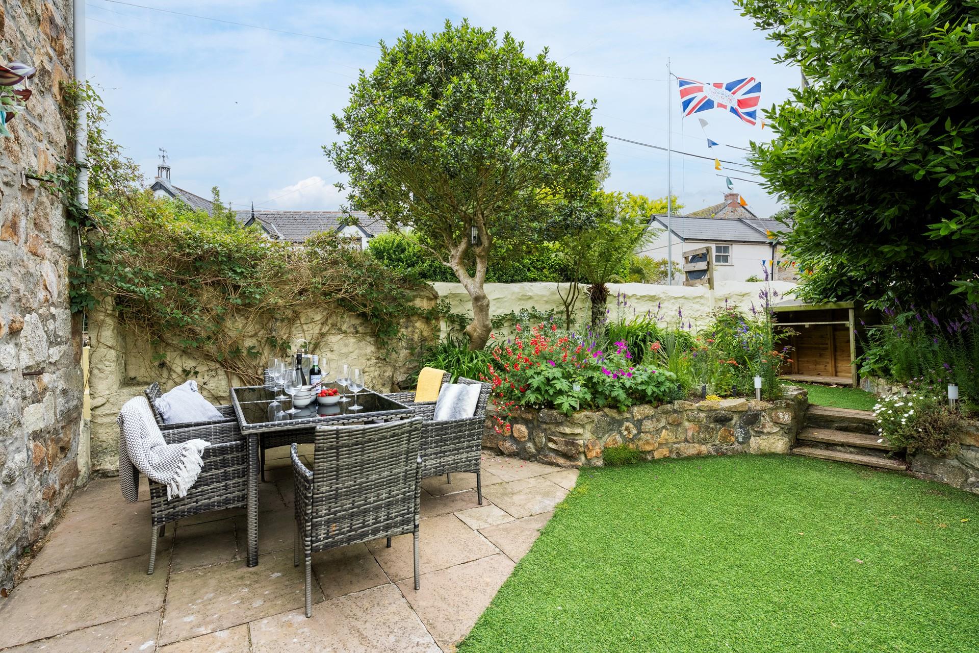 The enclosed garden is perfect for your furry friends to run in the sun.