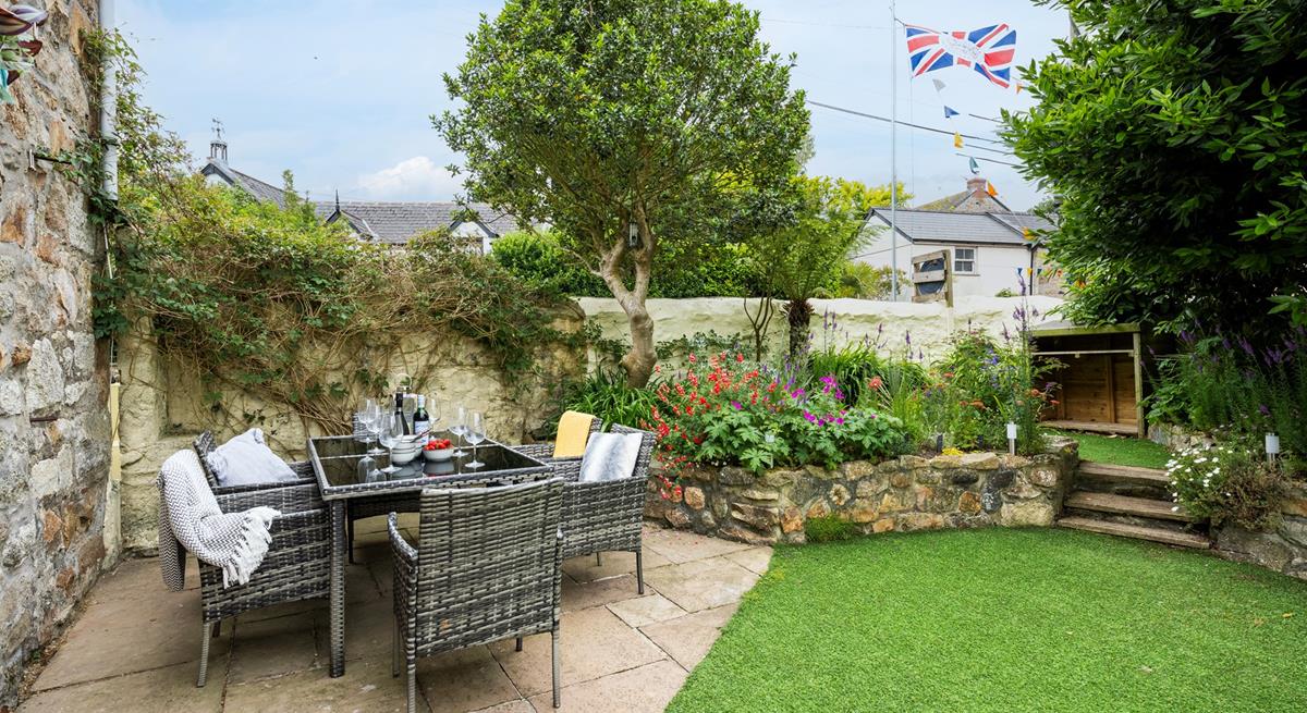 The enclosed garden is perfect for your furry friends to run in the sun.