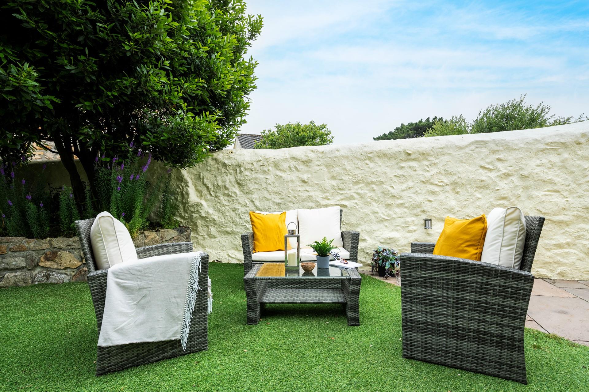 Pour a glass of wine and relax on the outside furniture.