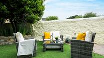 Pour a glass of wine and relax on the outside furniture.