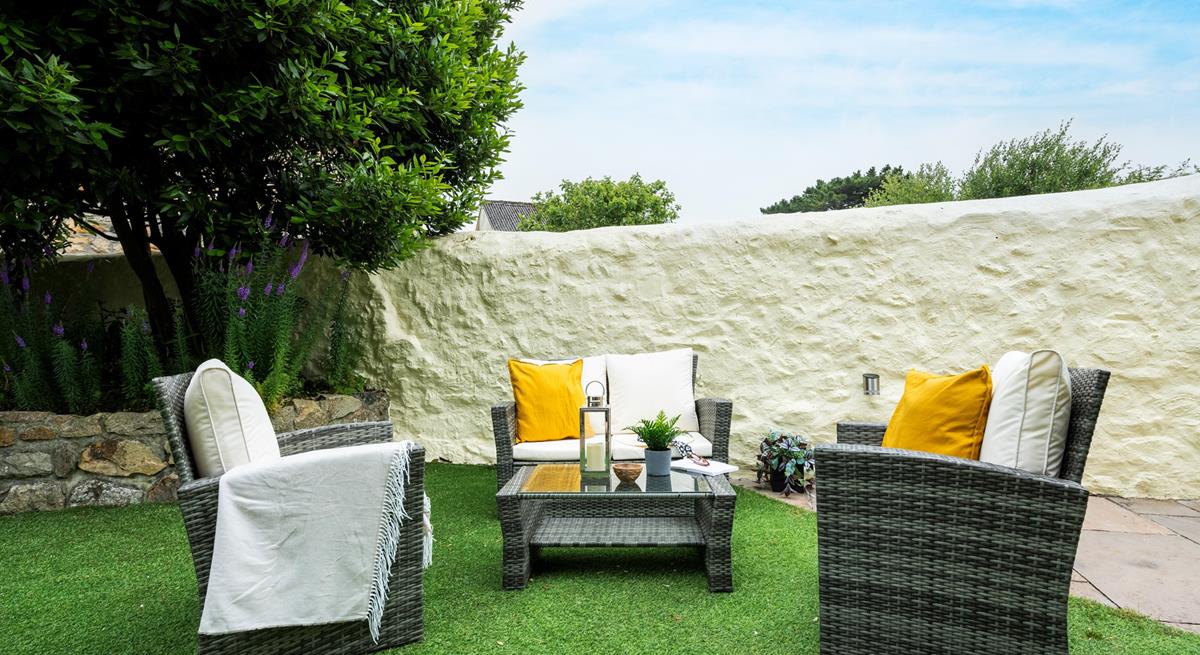 Pour a glass of wine and relax on the outside furniture.