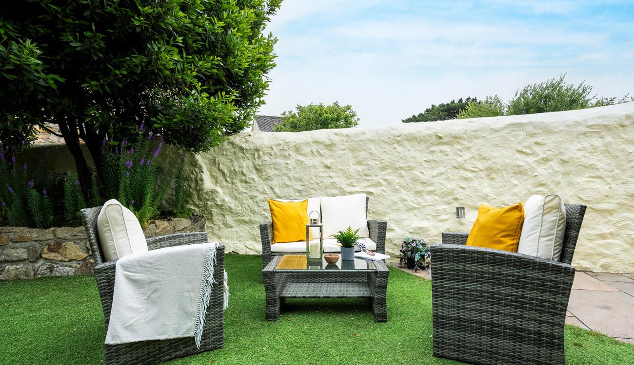 Pour a glass of wine and relax on the outside furniture.