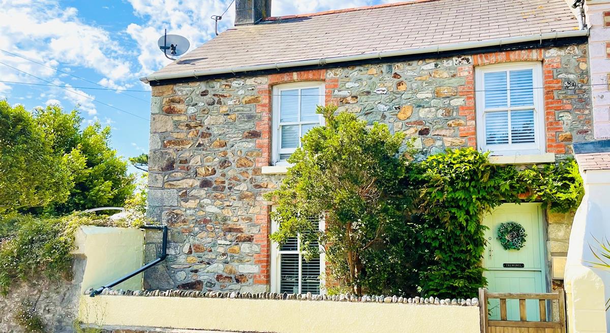 This delightful cottage is filled with charm for the perfect escape.